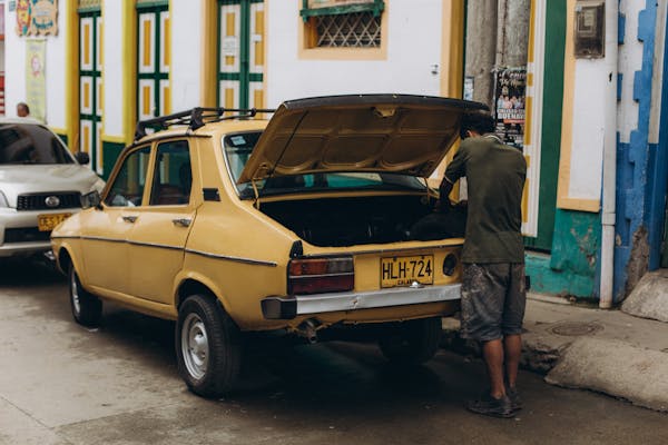 Spare tire, jack, and lug wrench retrieved from a car trunk